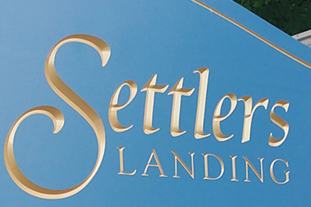 community-welcome-entrance-sign-carved-painted-gold-arched-settlers-landing-duff-signs-maryland-4 ada signs suite signs